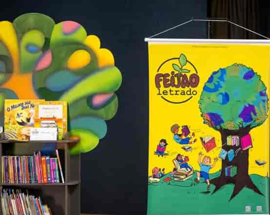 Banner do evento Feijão Letrado doa 696 livros e leva diversão e arte a estudantes de Americana